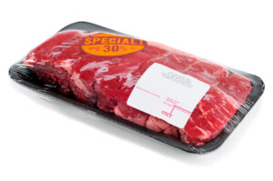 Top Sirloin Steak Roast In A Supermarket Packaging, Isolated On A White Background (c)www.normanpogson.com